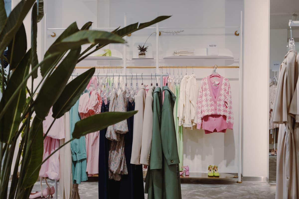 woman browsing clothes, vintage shop interior, Lisbon street view, authentic